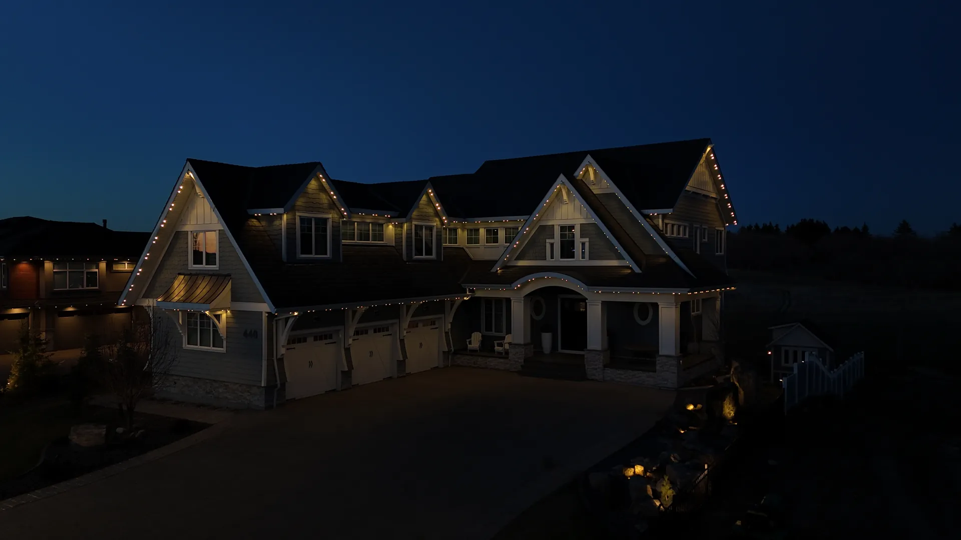 White-trimmed home with LED lighting installed in Sherwood Park, Alberta