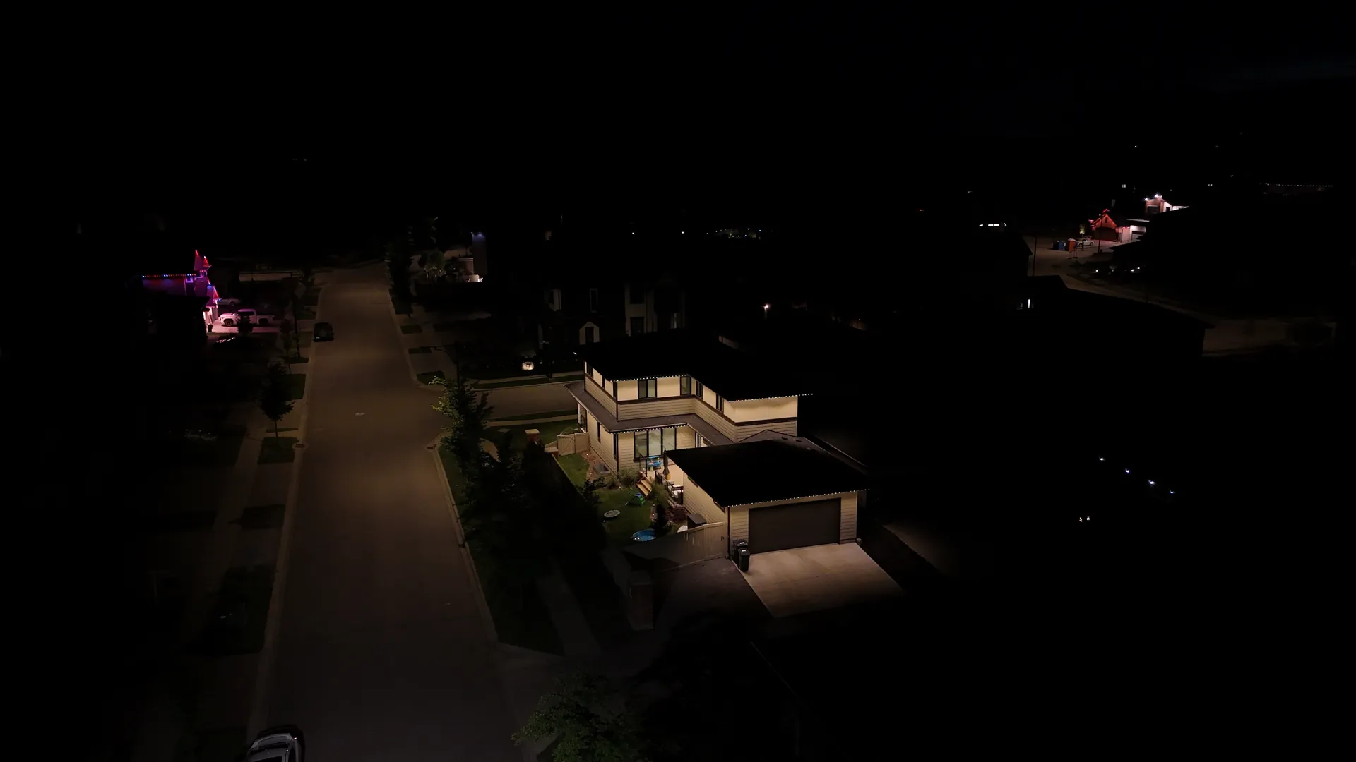 Drone shot of LED lighting on a home in Edmonton at night