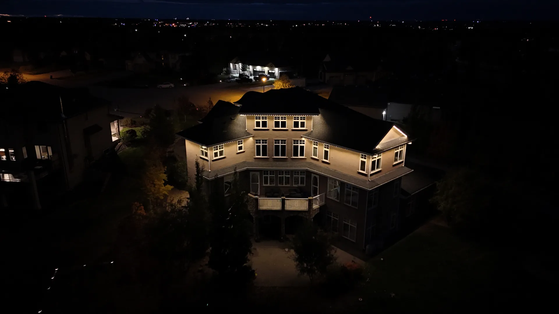 Drone view of LED roofline lighting on a home in Sherwood Park