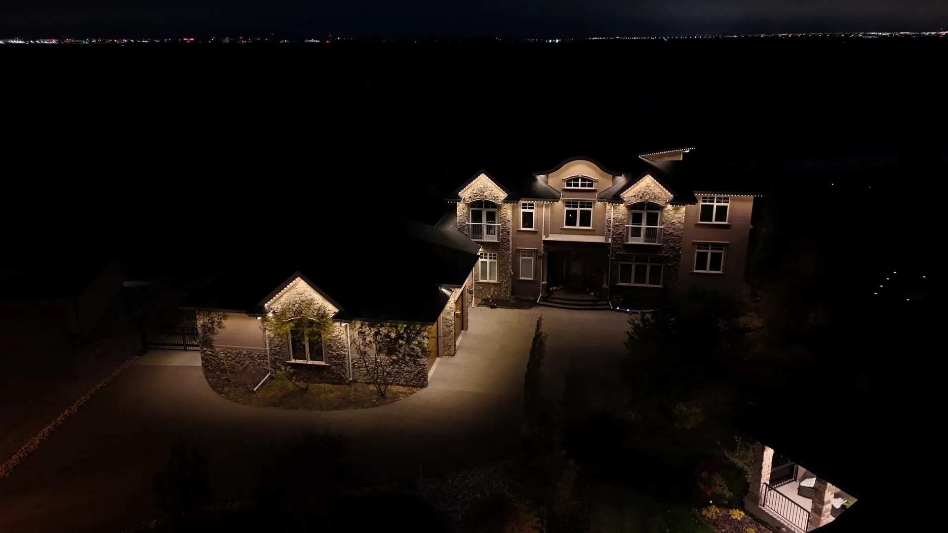 Aerial drone view of permanent LED lighting on a home in Edmonton
