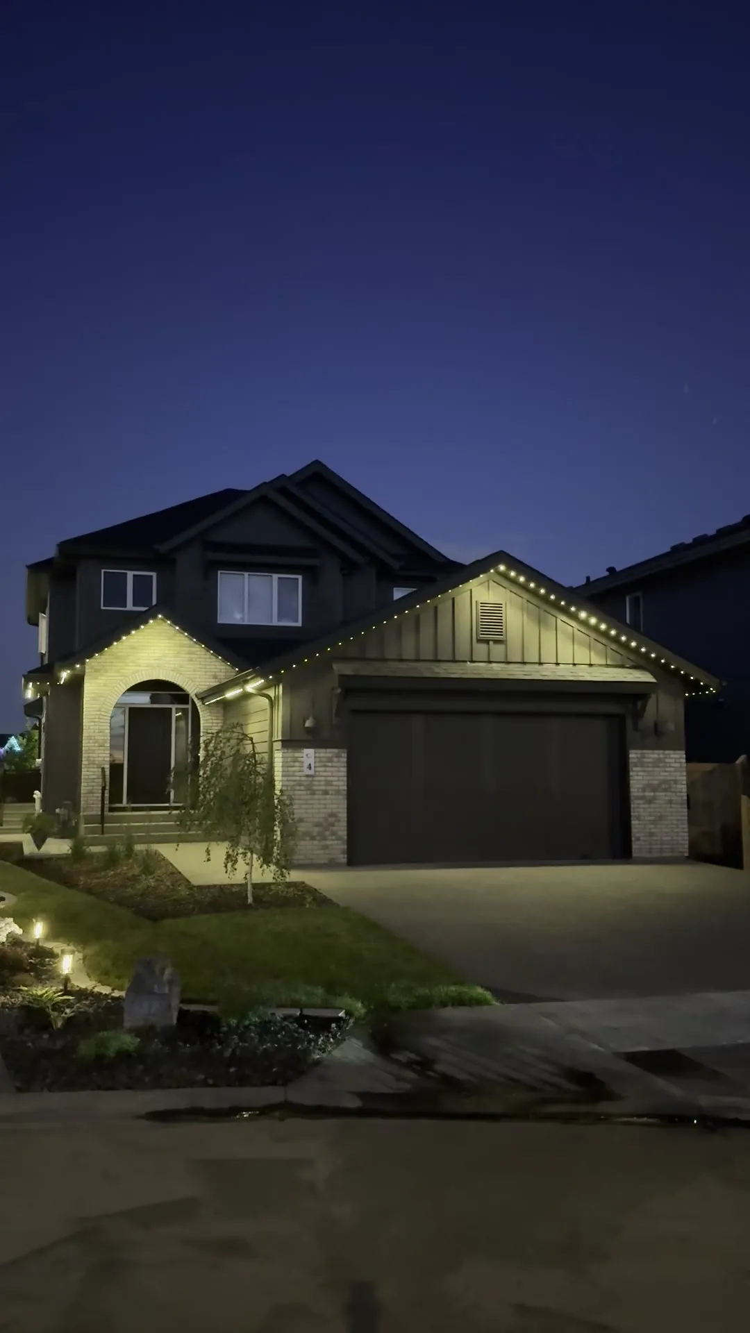 Edge-lit LED roofline lighting on a home in Edmonton, Alberta