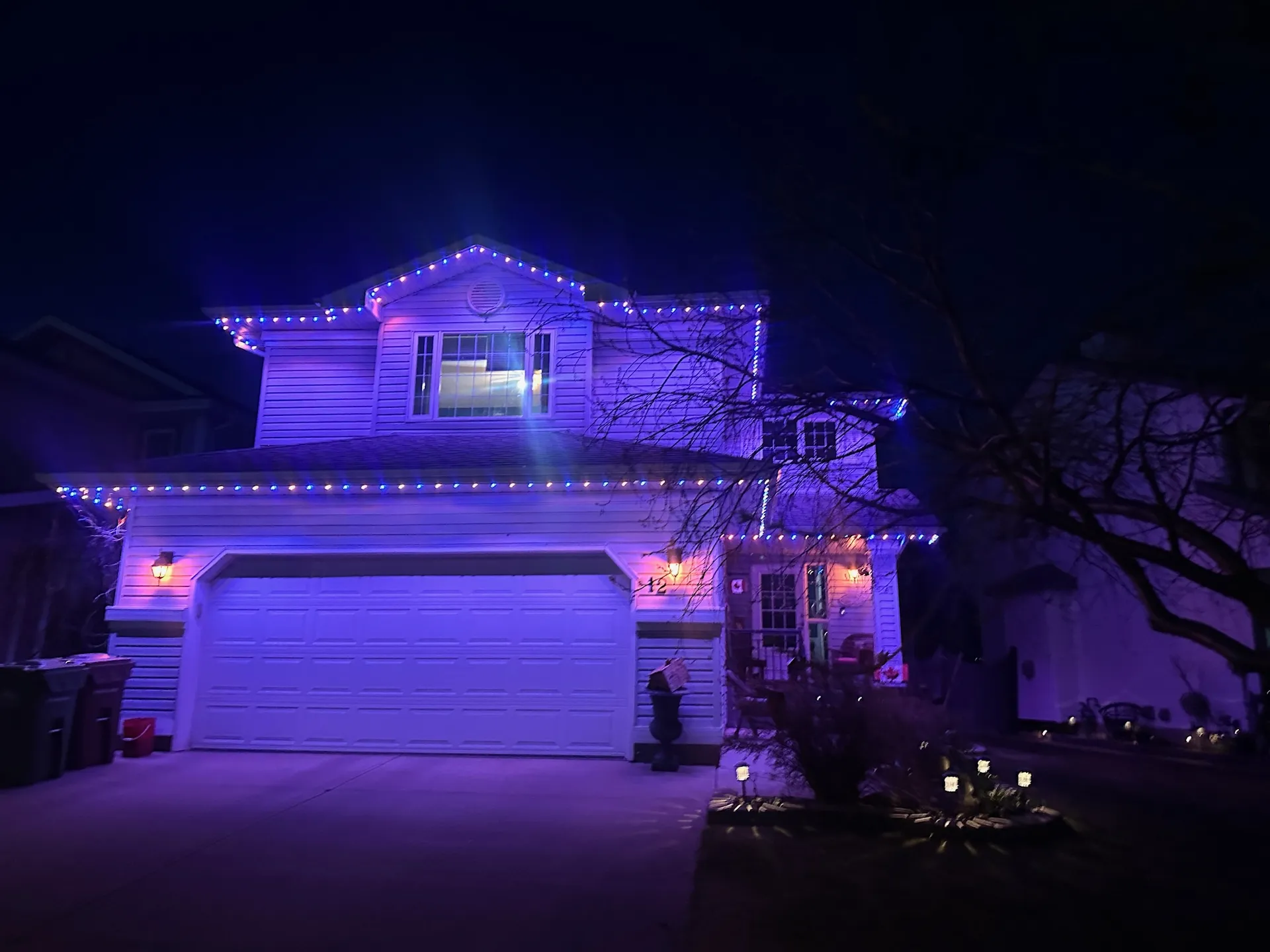 Permanent LED lighting on a modern home exterior in Leduc, Alberta