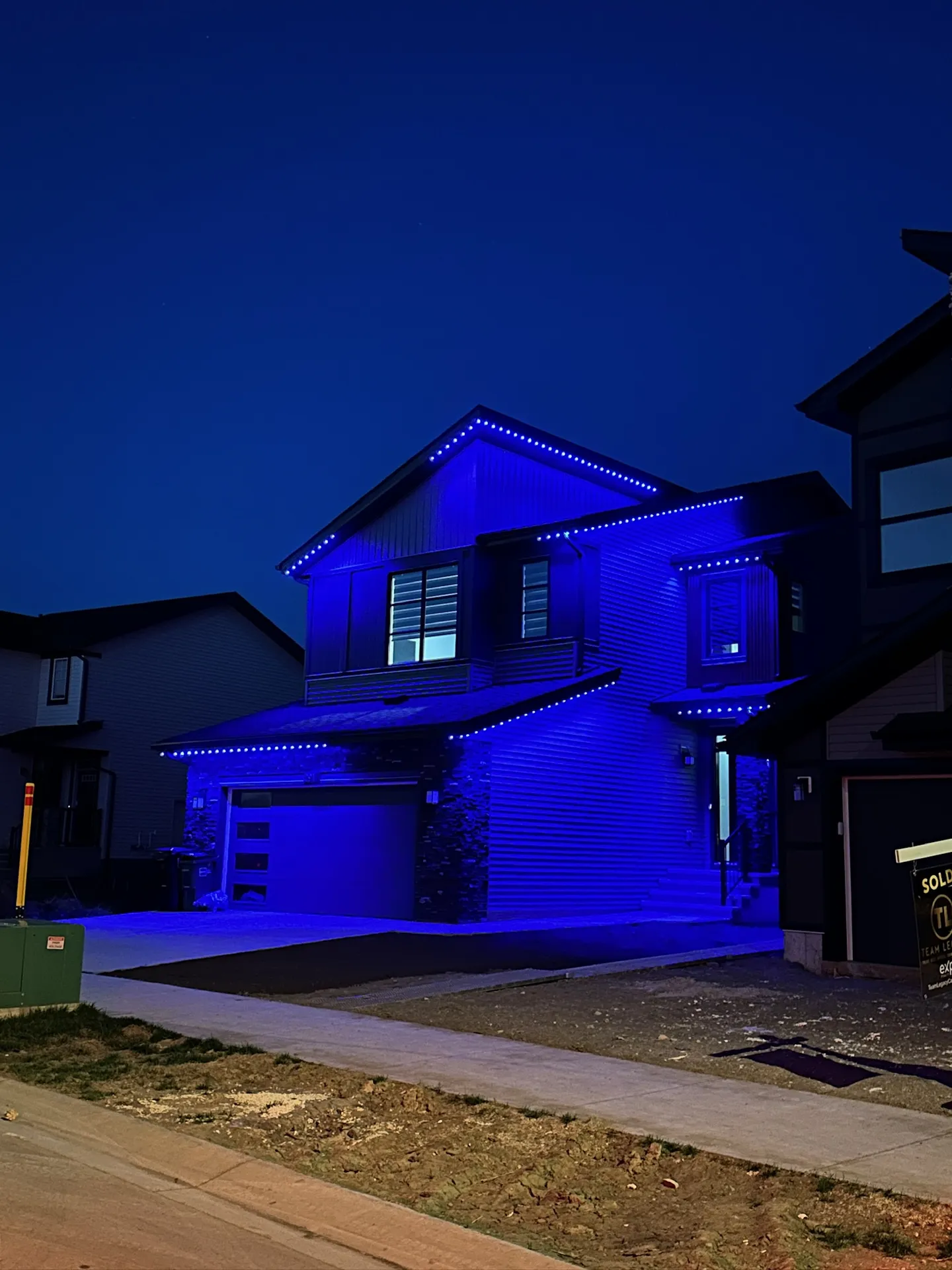 Elegant home with permanent roofline lighting in Edmonton, Alberta